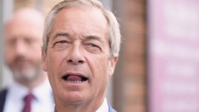 Nigel Farage speaking at a podium after the Makerfield by-election result