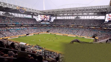 Spectators queueing outside a World Cup stadium with empty reusable bottles turned away.