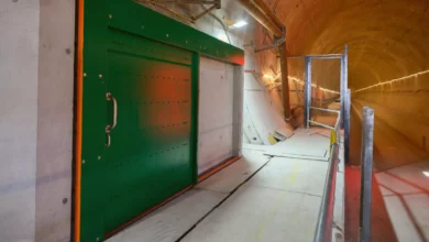 A 60kg safety door being lowered into position inside the Chiltern Tunnel bore