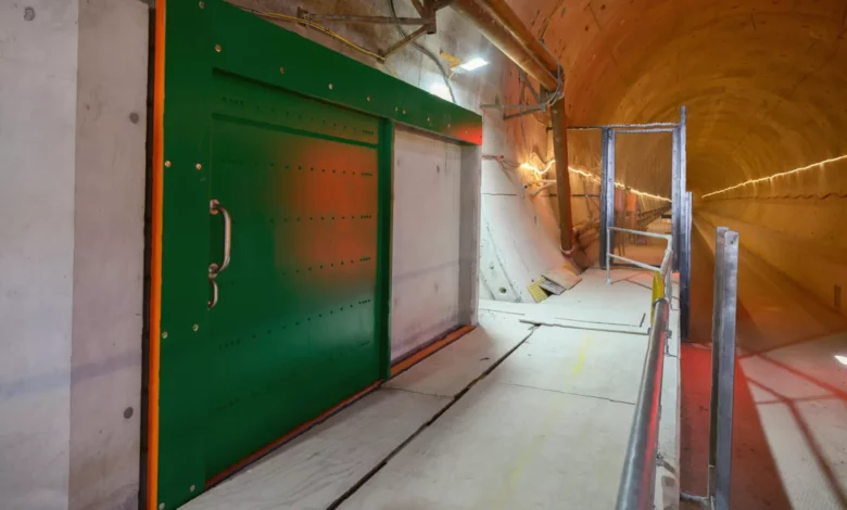 A 60kg safety door being lowered into position inside the Chiltern Tunnel bore