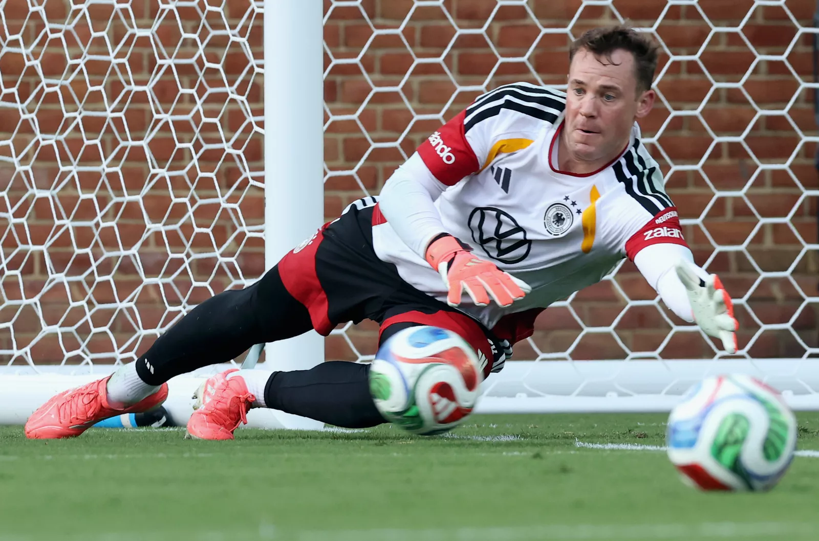 Manuel Neuer warms up in goal ahead of Germany’s opening World Cup match against Curacao