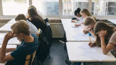 Primary school classroom with empty desks during a lesson
