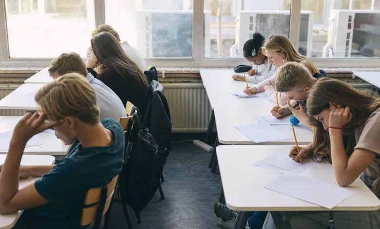Primary school classroom with empty desks during a lesson