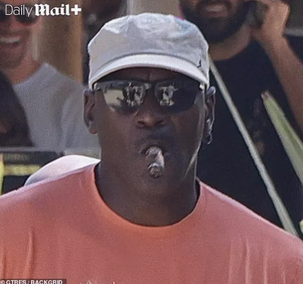 A 2024 photograph of Michael Jordan at a Monaco football match showing yellow eyes