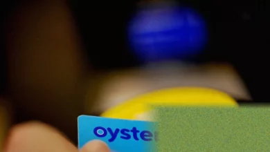 Commuters tapping cards on a bus reader in a northern English city