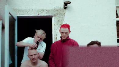 Four members of Bleech 9:3 stand outside a London rehearsal space