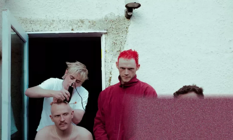 Four members of Bleech 9:3 stand outside a London rehearsal space