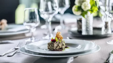A plate of foie gras being served in a restaurant, showing the imported delicacy.