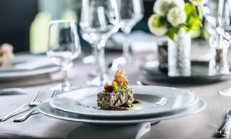 A plate of foie gras being served in a restaurant, showing the imported delicacy.