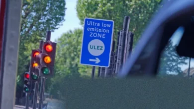 London's ultra-low emission zone sign on a busy city street