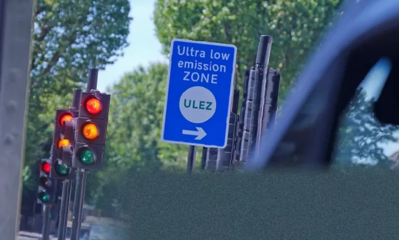 London's ultra-low emission zone sign on a busy city street