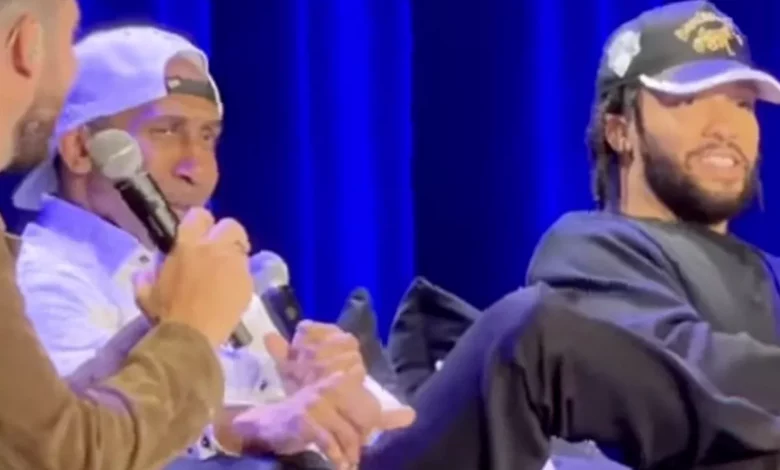 Madison Square Garden stage during a live podcast recording with booing fans
