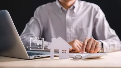 A landlord reviewing a stack of official government compliance documents and deadline checklists at a desk