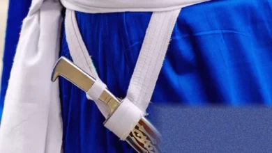 A Sikh student wearing a swaddled kirpan under their school uniform