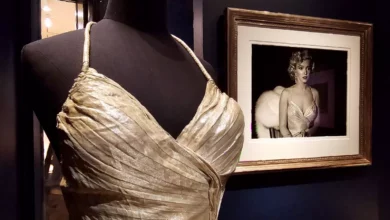A gallery room filled with black-and-white photographs of Marilyn Monroe on white walls
