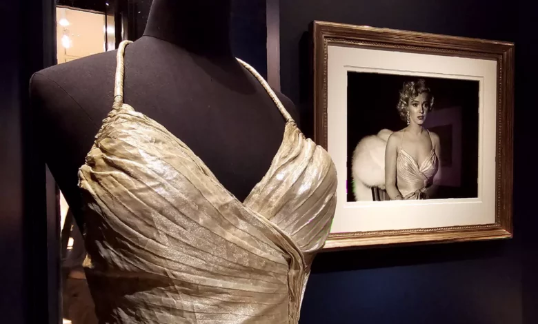 A gallery room filled with black-and-white photographs of Marilyn Monroe on white walls