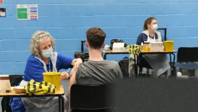 A student receiving a vaccination injection at a UK university health centre