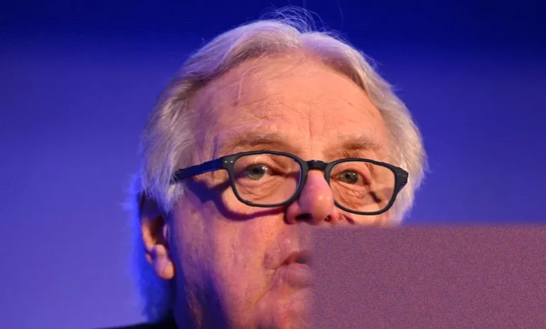 Former Ofcom chairman Lord Michael Grade speaking in a television studio interview.