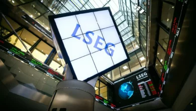 Traders on the London Stock Exchange floor watching screens