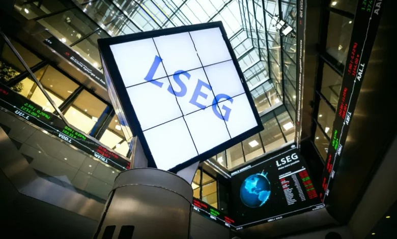 Traders on the London Stock Exchange floor watching screens