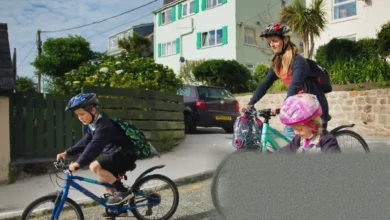 Schoolchildren walking and cycling on a safe route to school in an English town