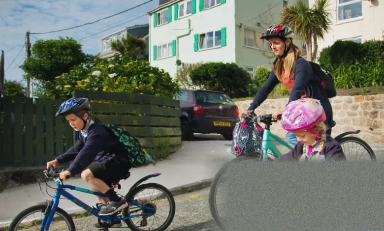 Schoolchildren walking and cycling on a safe route to school in an English town