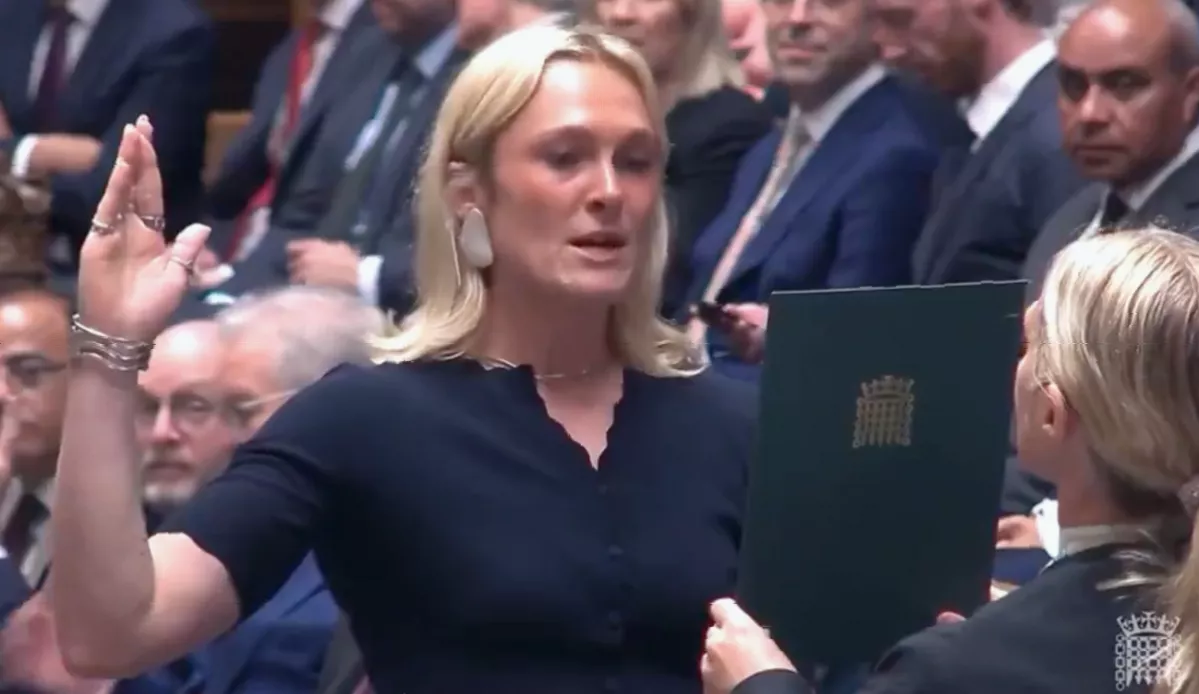 SNP MP stands at the Commons despatch box for the ceremonial swearing-in to Parliament