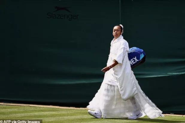 Close-up of a kanzashi hair ornament and pearl jewellery worn with a white tennis dress on court