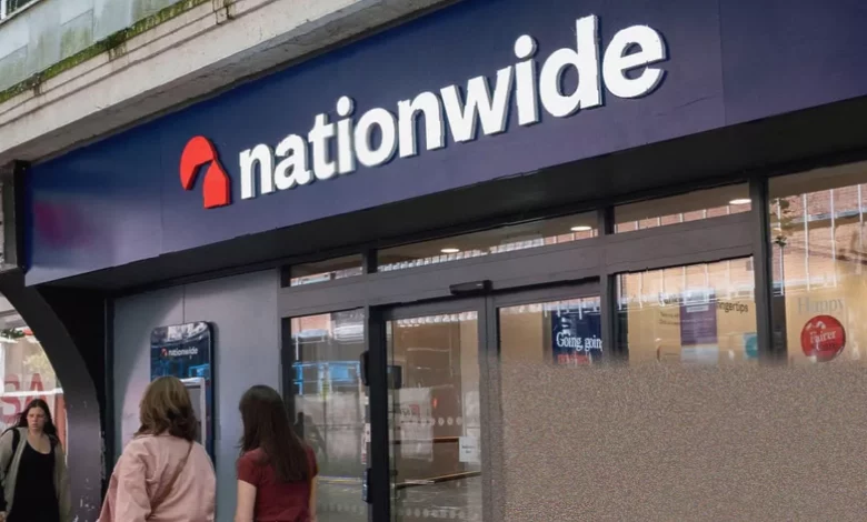 Nationwide and Virgin Money branch signs side by side on a high street.