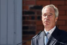 Nigel Farage speaking to journalists outside a parliamentary building in London