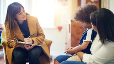 Children waiting in a bright NHS mental health clinic reception area