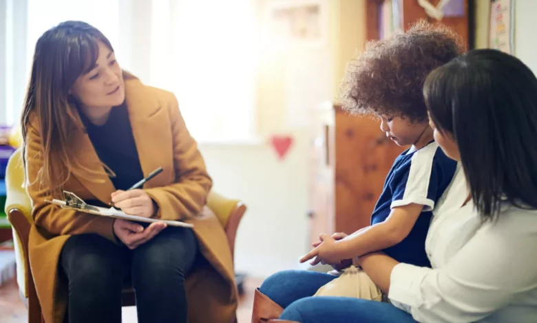 Children waiting in a bright NHS mental health clinic reception area