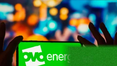 An Ovo Energy smart meter and prepayment key on a kitchen counter