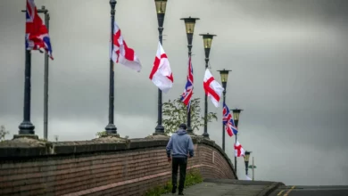 Union Jack and St George's flags tied to lampposts along an Oxfordshire street