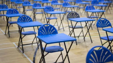 Students leaving an exam hall after a difficult A-level maths test