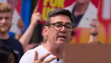 Andy Burnham arrives at Westminster in a black cab from Euston station with two aides