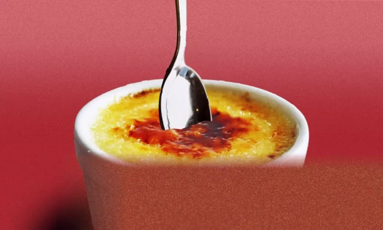 Woman refusing to share a crème brûlée in a restaurant dining room