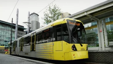 Artist's impression of a Metrolink tram passing Salford Crescent university campus