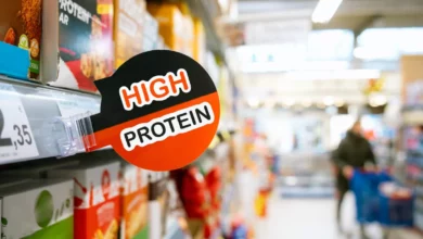 Supermarket dairy aisle packed with protein-labelled yoghurts and milkshakes