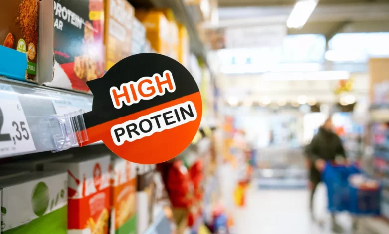 Supermarket dairy aisle packed with protein-labelled yoghurts and milkshakes