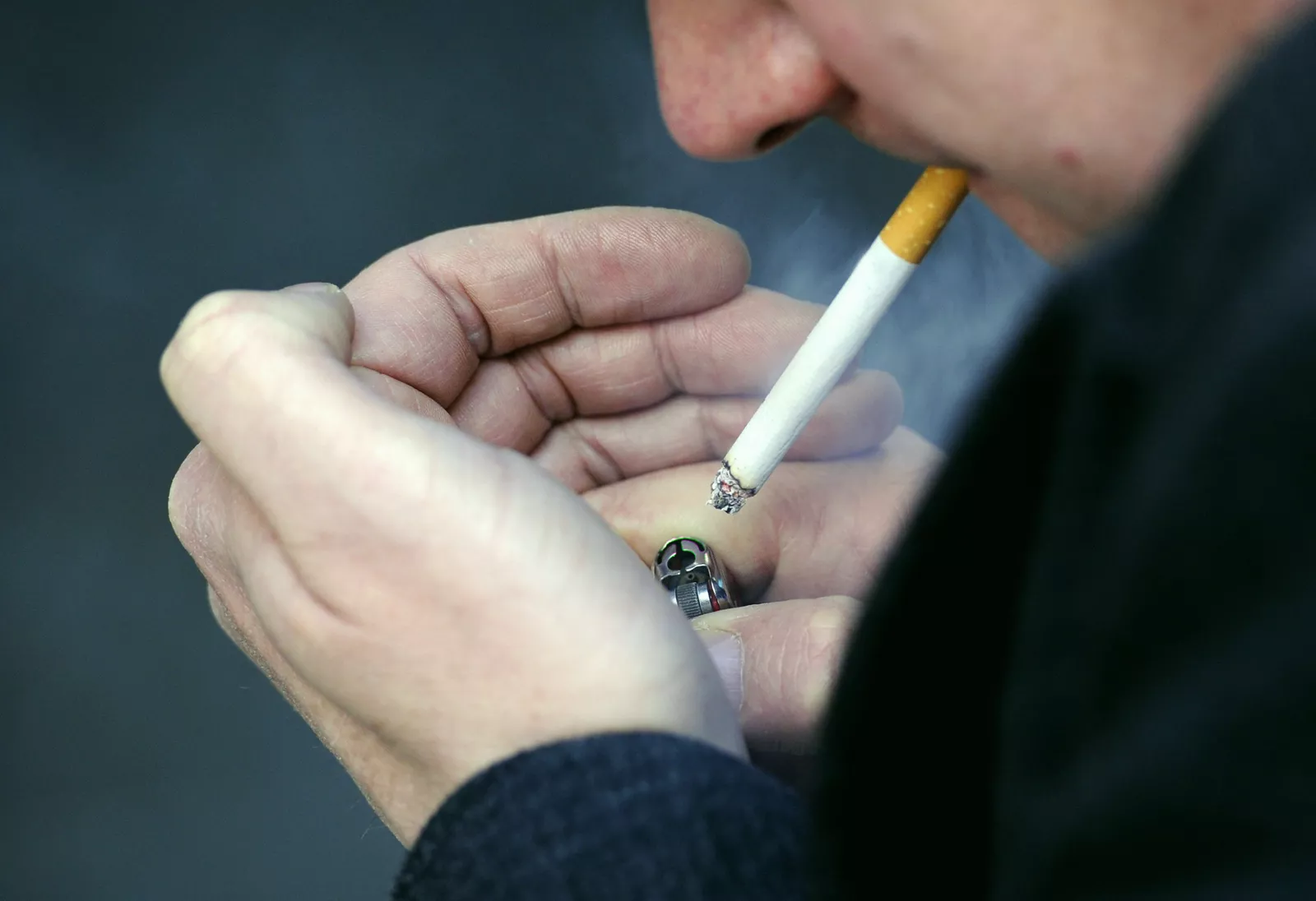 Border Force officers inspecting seized cigarette cartons at a port