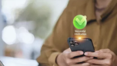 A person using a smartphone to place a bet on a gaming app with a digital wallet interface.
