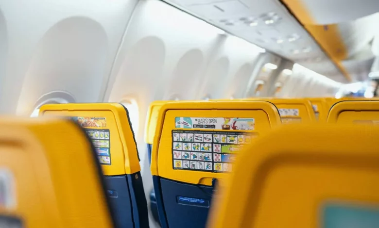 Exterior of a Ryanair aircraft parked at an airport gate