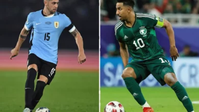 Two football teams walk onto the pitch at Hard Rock Stadium in Miami before a World Cup match