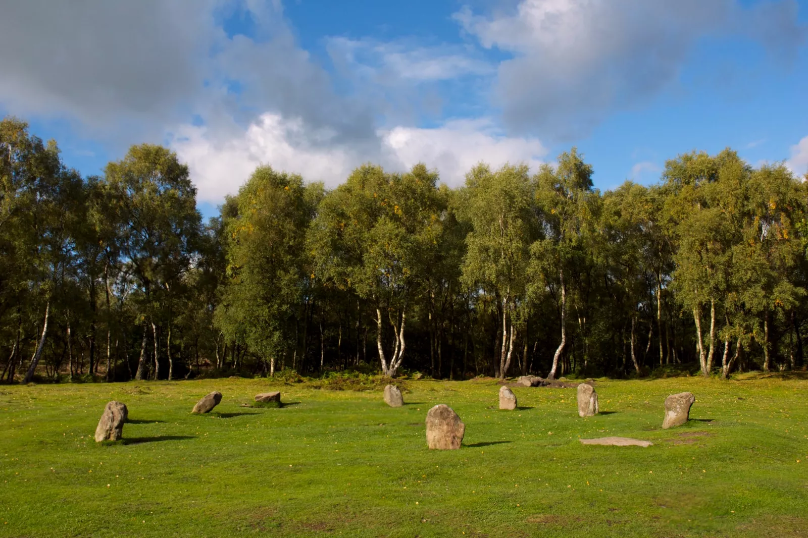 A Bronze Age stone circle surrounded by moorland in the Peak District at dawn