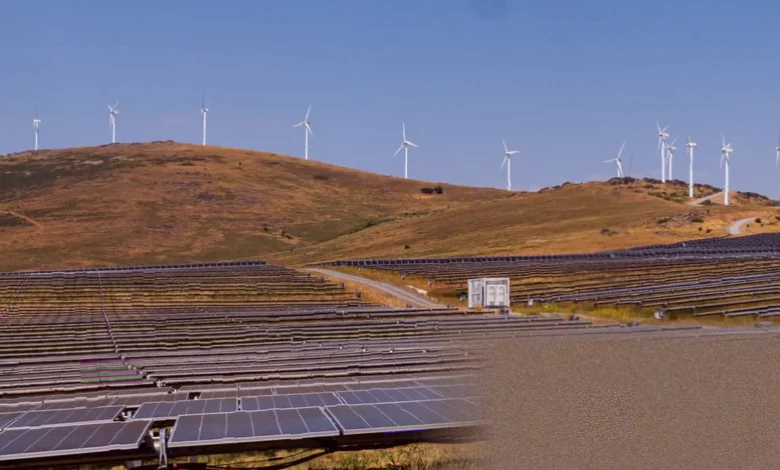 Wind turbines and solar panels in a Spanish landscape generating renewable electricity