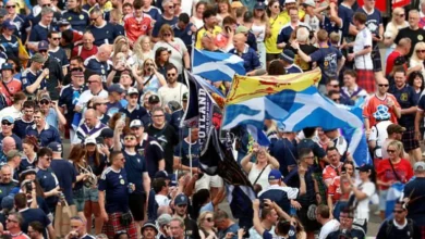 Tartan Army fans in kilts celebrating on the concourse at Fenway Park