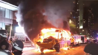 Police in riot gear clash with crowds near Times Square during Knicks victory celebrations
