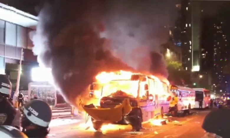 Police in riot gear clash with crowds near Times Square during Knicks victory celebrations