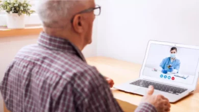 Pharmacist conducting a remote video consultation with a patient in a home setting